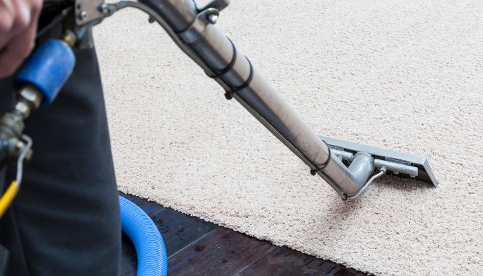 vacuum cleaning the carpet - carrollton odor removal